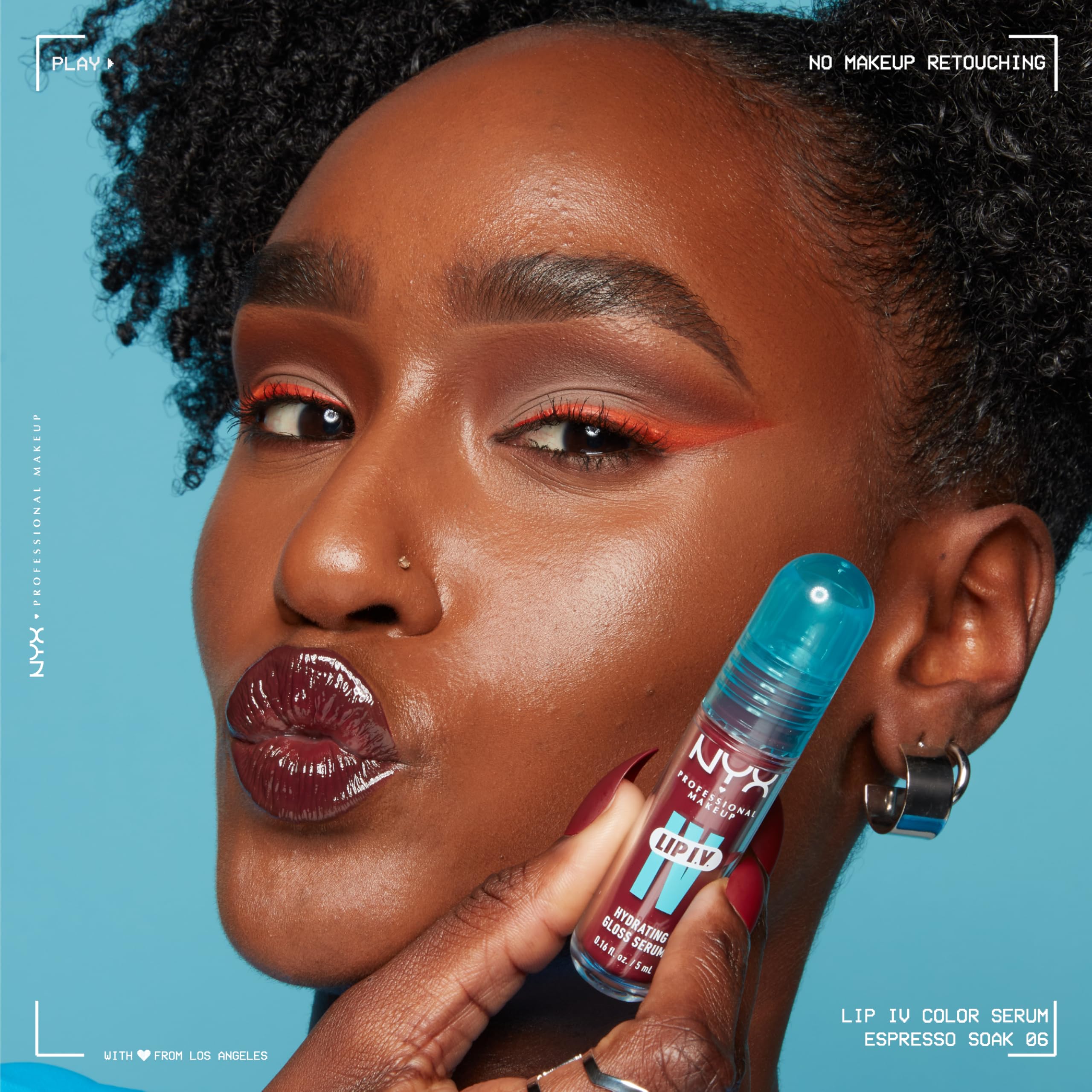 Model applying NYX Lip IV Hydrating Gloss Stain in Espresso Soak with a vibrant makeup look