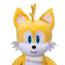 Close-up of yellow plush character face with blue eyes, white muzzle, and pointy ears.