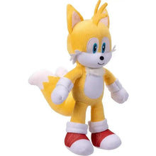 Yellow and white plush character with blue eyes, white gloves, and red shoes in 3/4 view.