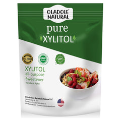 Oladole Natural pure xylitol sweetener UAE pouch packaging all purpose sugar substitute next to bowl of berries