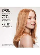 Woman with shoulder-length auburn hair