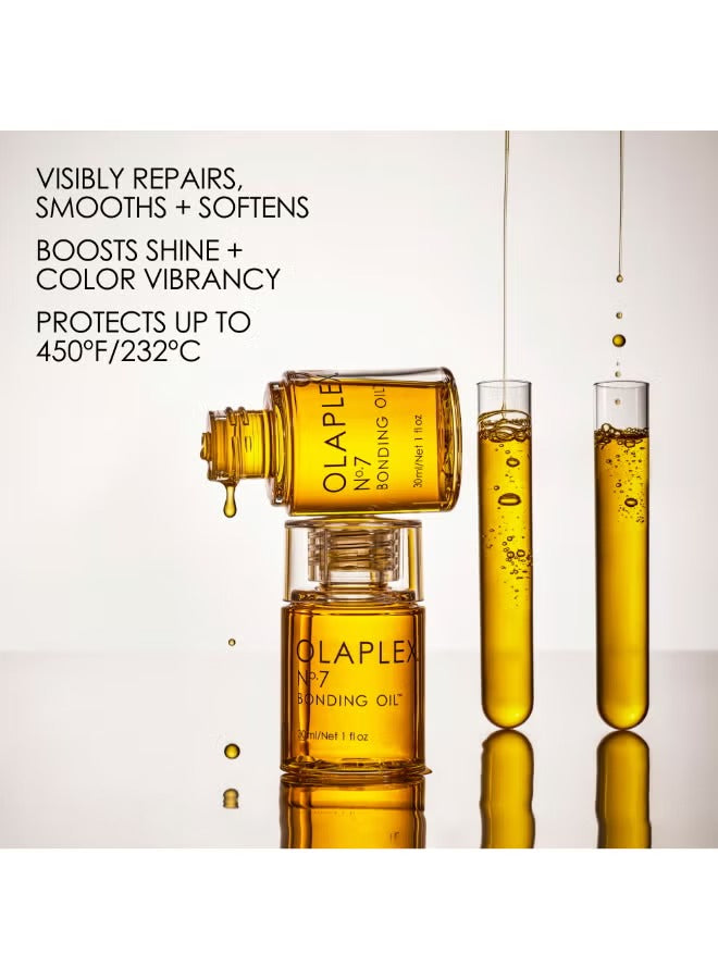 Olaplex No.7 Bonding Oil 30ml bottles with liquid splashes, designed to repair and enhance shine.