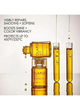 Bonding oil bottles with golden liquid, droplets, and slender tubes