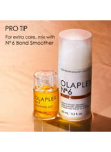 Olaplex No.7 bonding oil bottle and cream tube with golden oil