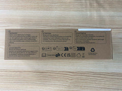 VIBOOS electric heating pad for back pain in cardboard retail box showing warning labels and icons on wood