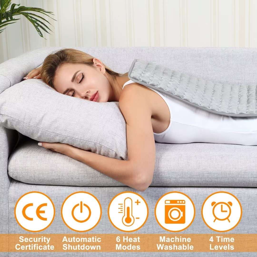 Woman using VIBOOS electric heating pad for back pain lying on couch with pad over upper back and feature icons