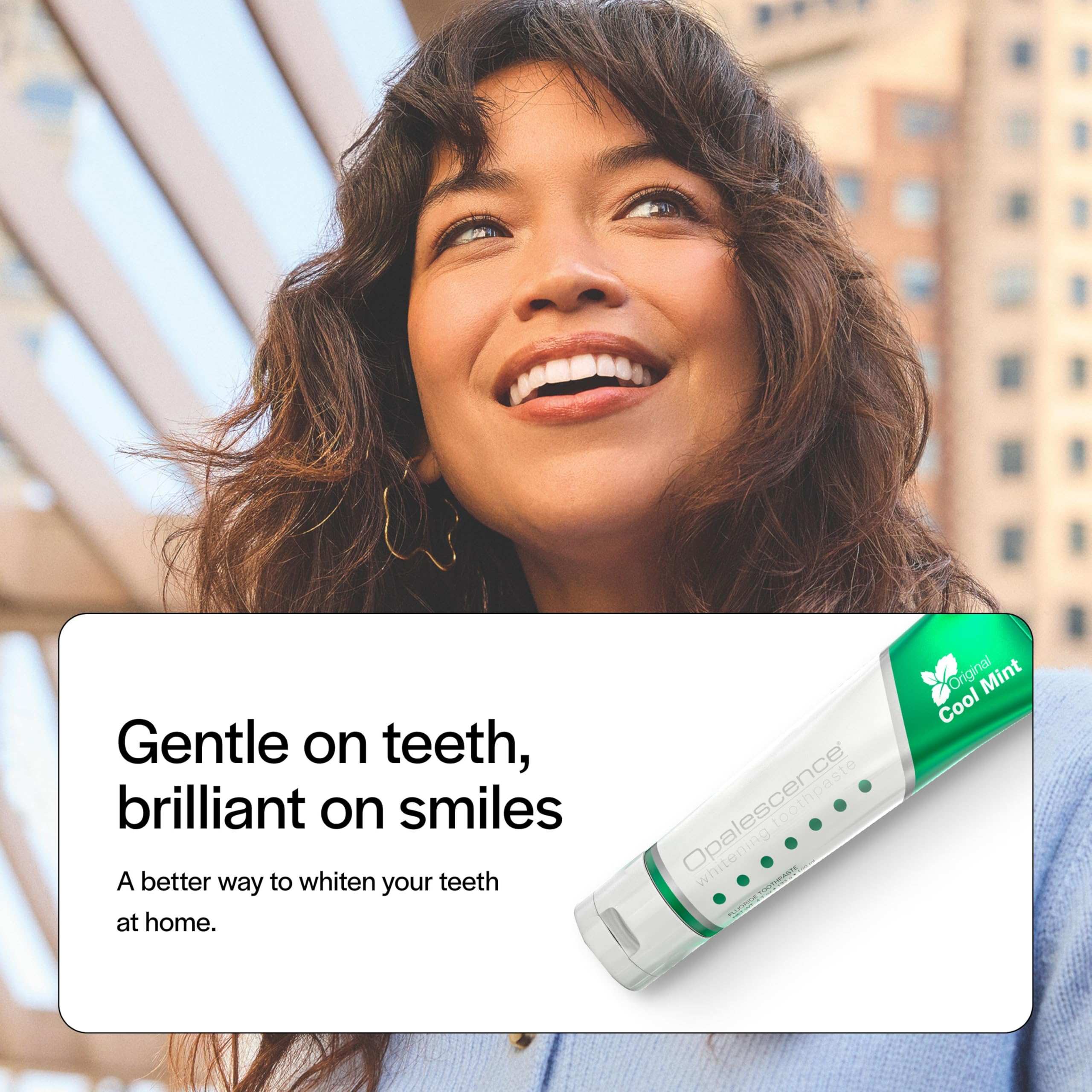 Smiling woman with product panel showing Opalescence toothpaste tube and opalescence whitening toothpaste Cool Mint flavor