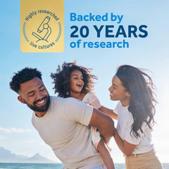 OptiBac daily probiotics capsules UAE ad showing smiling family on a beach backed by 20 years of research