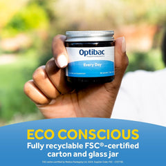 OptiBac Every Day probiotic jar held in hand outdoors with eco conscious label daily probiotics capsules UAE