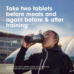 Athlete drinking from Optimum Nutrition shaker bottle outdoors with dosing instructions text Optimum Nutrition Amino 2222 tablets