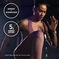 Fit woman doing high knee exercise in purple workout set showing Optimum Nutrition pre workout energy hydration