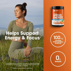 Optimum Nutrition pre workout Amino Energy tub with 100 mg caffeine and 0g sugar beside woman meditating outdoors