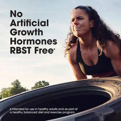 Optimum Nutrition whey protein powder ad showing determined woman flipping a tire with RBST free claim