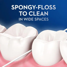 Spongy-style dental floss strand cleaning between teeth on a model