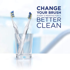 Oral-B 3DWhite Whitening Therapy Toothbrush two white handled toothbrushes standing in a clear glass with change brush reminder