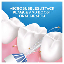 Water flosser spraying microbubbles onto a tooth model for oral health