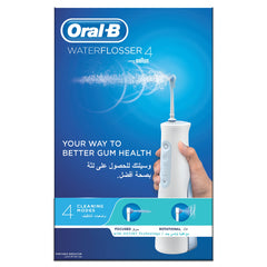 Oral-B Aquacare water flosser portable cordless white unit held in hand on blue box showing 4 cleaning modes