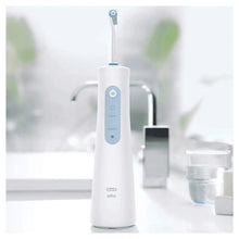 Oral-B cordless water flosser with white base and rotating spray nozzle