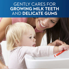 Mother helping toddler brush at sink with Oral-B baby toothpaste 0-2 years for gentle milk teeth care