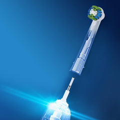 Oral-B battery powered toothbrush replacement round brush head with blue green bristles detached from handle