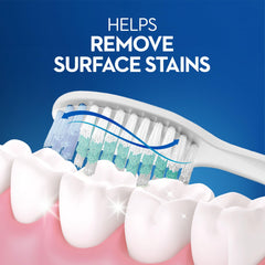 Oral-B Classic toothbrush medium close up brushing teeth to remove surface stains with angled bristles