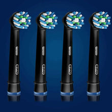 Four black electric toothbrush replacement heads with green-and-white bristles