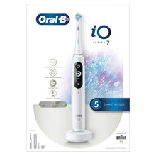 Electric toothbrush with white handle, black display buttons, and charging stand