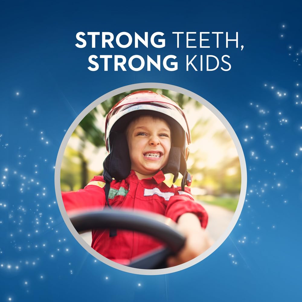 Oral-B Junior 6+ soft toothbrush ad showing smiling child in helmet driving a toy car with slogan Strong Teeth Strong Kids