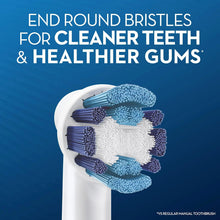 Toothbrush with Oral-B replacement head, white handle holding blue bristles