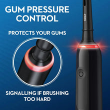 Black electric toothbrush with pressure control indicator near brush head