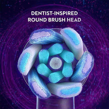 Round brush head bristles with blue filaments, in a dense brush cluster