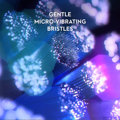 Oral-B iO replacement brush heads close up showing gentle micro vibrating bristles illuminated in blue and purple light