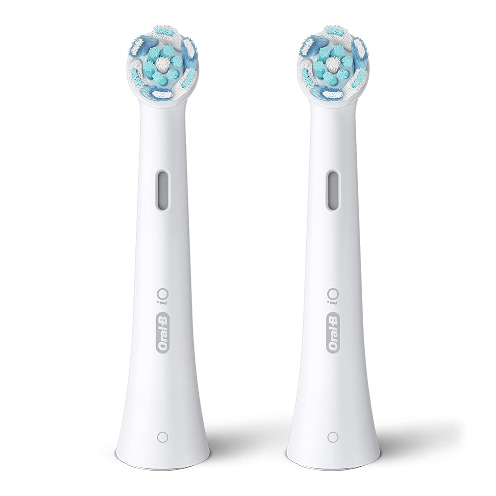 Pair of Oral-B iO replacement brush heads with blue and teal round bristles for electric toothbrush