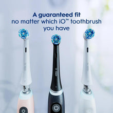 Set of electric toothbrush handles with blue bristle heads in white and black