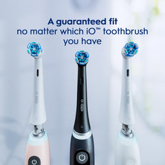 Three Oral-B iO toothbrush handles with blue-tipped Oral-B iO Series replacement brush heads showing guaranteed fit