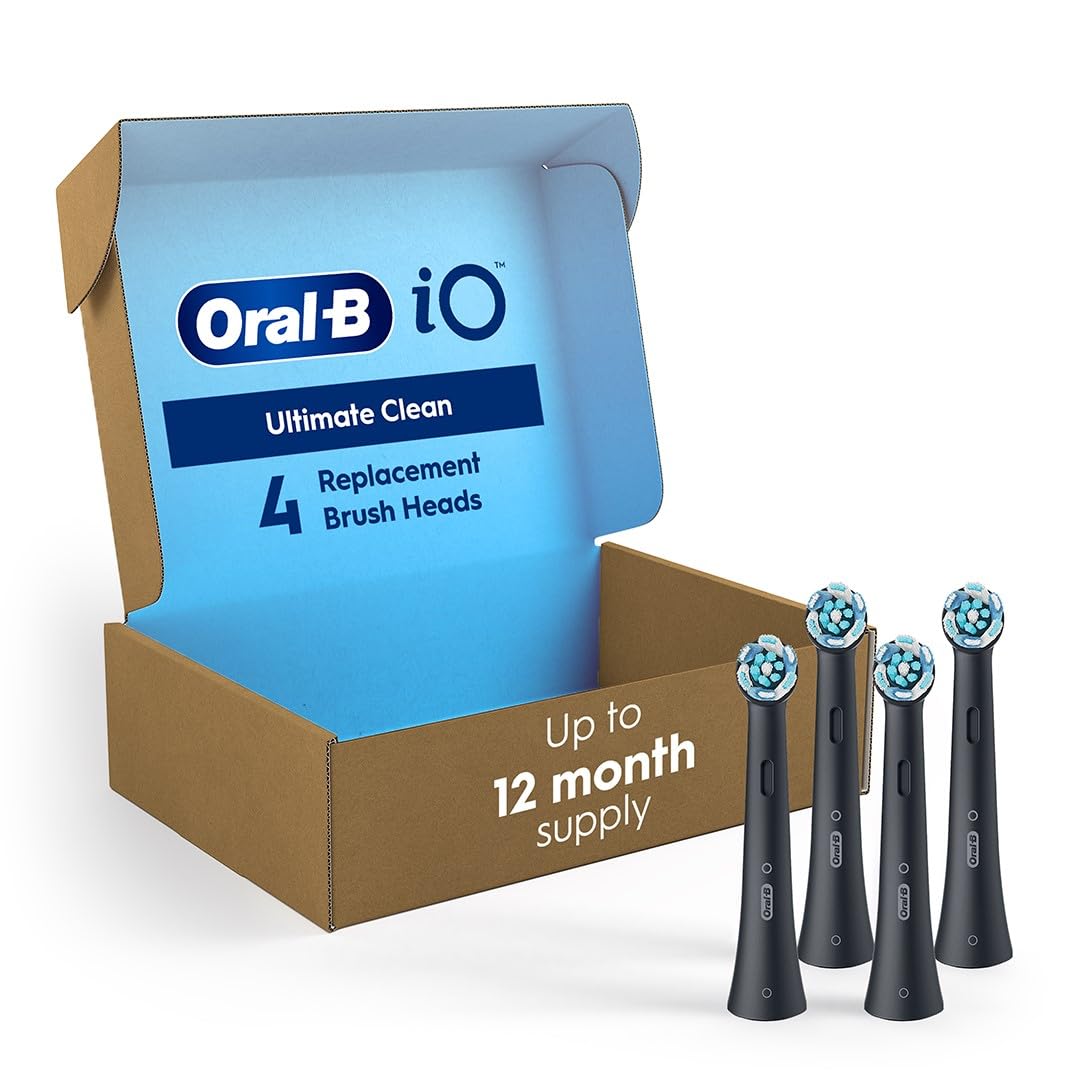 Oral-B iO Series replacement brush heads pack of 4 black brush heads with blue and white bristles beside open box