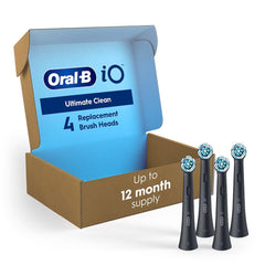 Oral-B iO Series replacement brush heads pack of 4 black brush heads with blue and white bristles beside open box