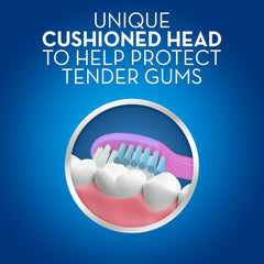 Oral-B kids toothbrush 2-4 years close up showing cushioned head gently cleaning teeth and protecting gums