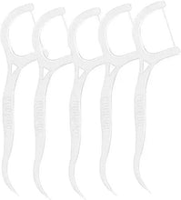White plastic dental floss picks with curved handles, multiple sticks
