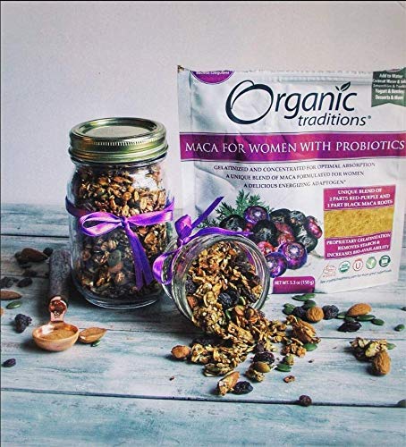 Organic Traditions box labeled maca powder for women with probiotics with jars of granola nuts and wooden spoon