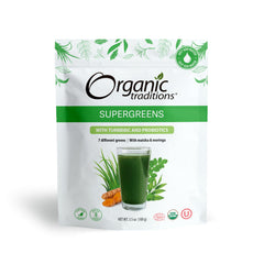 Organic Traditions supergreens powder with turmeric and probiotics pouch showing glass of green drink turmeric root and leaves