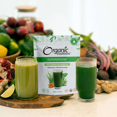Organic Traditions supergreens powder with turmeric and probiotics. Package with two green smoothies and fresh produce