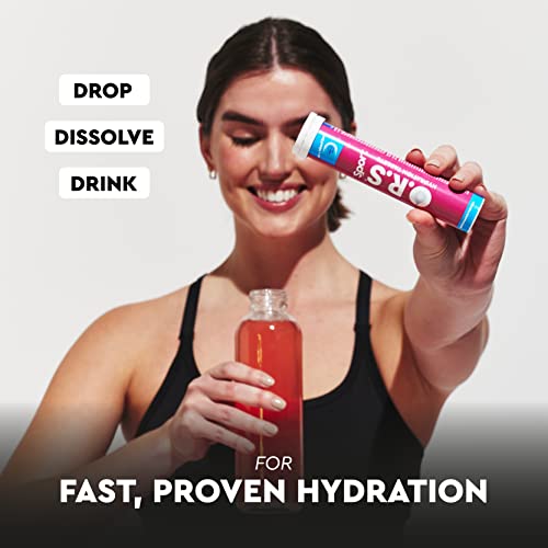 Smiling woman pouring ORS tube into water bottle for fast proven hydration ORS sport hydration tablets orange