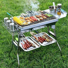 Outdoor barbecue smoker grill with food on grate and lid pot on side shelf