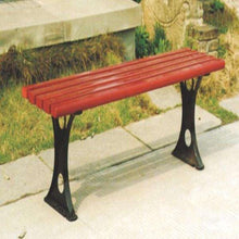 Red slatted outdoor bench with black metal legs and flat end supports