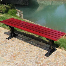 Red slatted outdoor bench with curved black metal supports and four feet