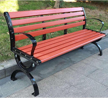 Outdoor bench with red slatted seat and backrest, black metal frame and legs