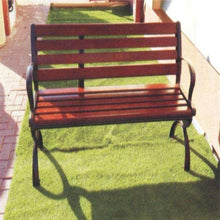 Outdoor bench with red slatted seat and backrest, black metal frame and arms