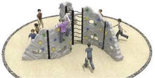 Outdoor rock climbing playground with gray climbing walls and central ladder