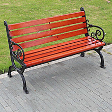 Outdoor bench with red-brown slatted seat and back, ornate black metal scroll frame